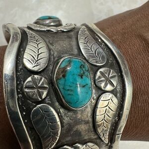 This is a vintage Navajo sterling silver and turquoise watch cuff bracelet